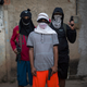 “Young drug traffickers pose for a photo wielding their weapons. Teenagers openly tote guns while they work as guards, lookouts and distributors for drug lords operating just a few miles from where hundreds of thousands and tourists and athletes will be for the Aug. 5-21 Olympic Games.”
